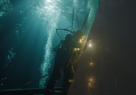Image of a diver rendered one half Rec 709/one half bare LogC4